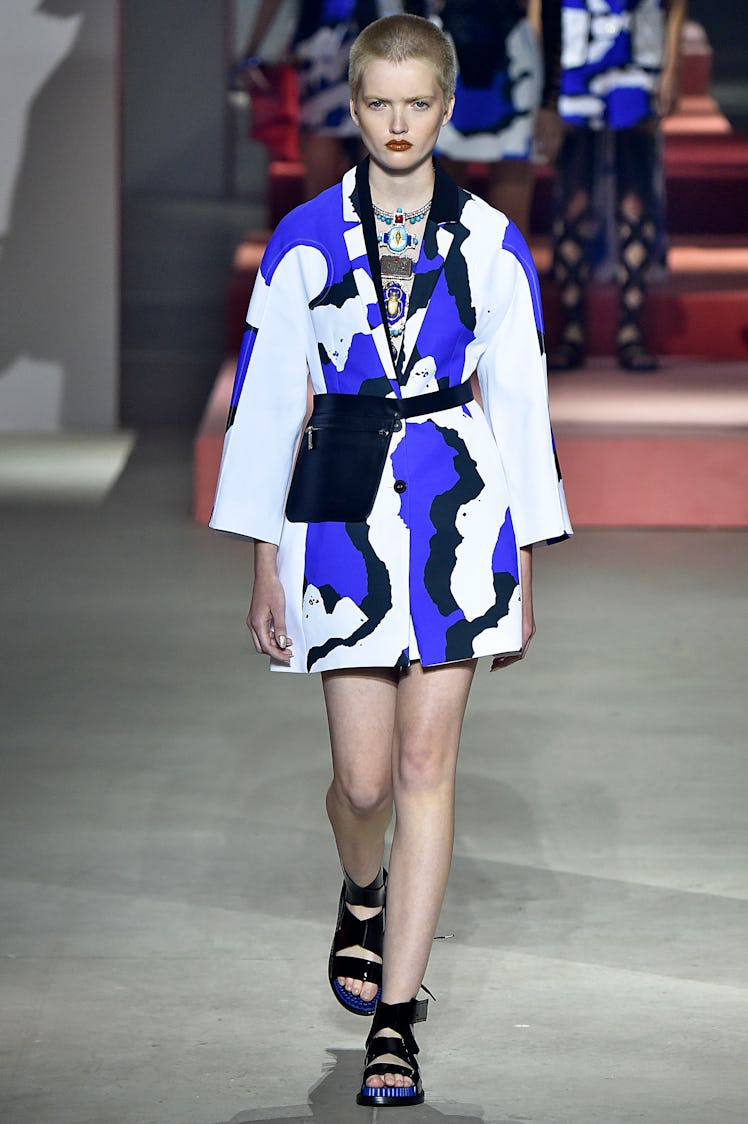Ruth Bell walking down the runway while wearing a Kenzo blue, black, and white dress at the Paris Fa...