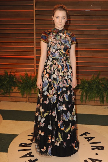 Saoirse Ronan wearing a black floral gown at the Vanity Fair Oscar Party