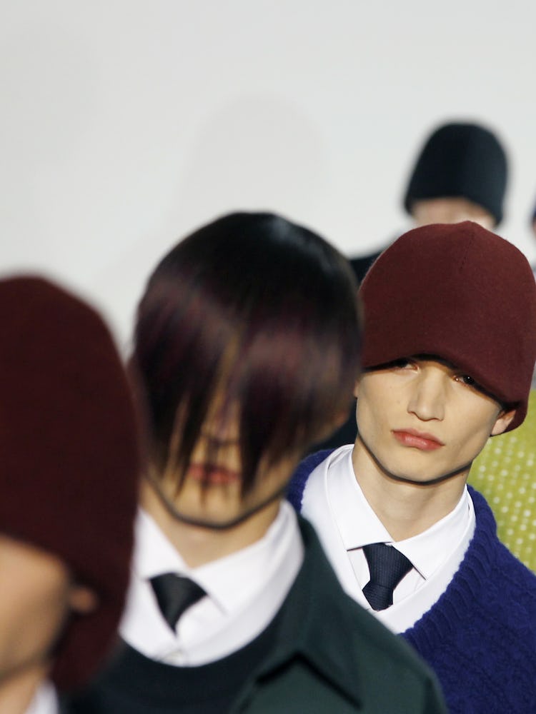 Models backstage at Raf Simons Fall 2012 show in Paris