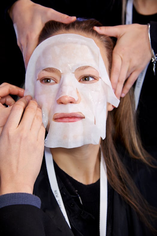 A model wears an SK-II mask backstage