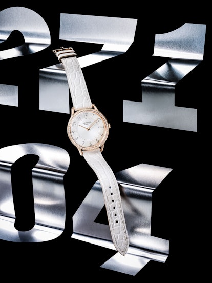 Hermès gold and diamond watch