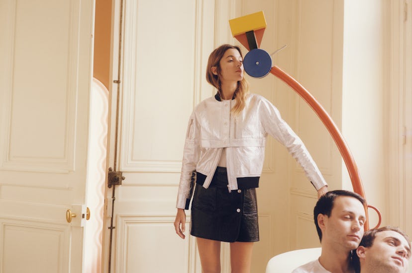 Lolita Jacobs wearing a Courrèges silver jacket and black leather skirt, with Meyer and Vaillant in ...