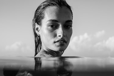 Model posing in the water, in black and white
