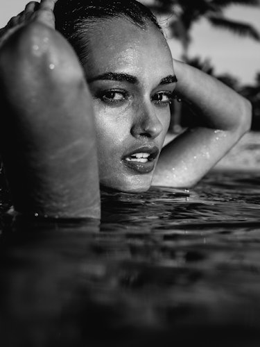 Gizele Oliveira posing in a pool for a series of photos from “Fyre Cay” in the Bahamas
