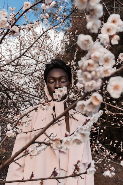 A model behind a cherry blossom in Margaret Zhang's photo essay 