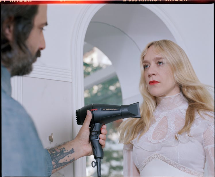 Chloe Sevigny getting her hair done by a hairstylist by Davey Adesida