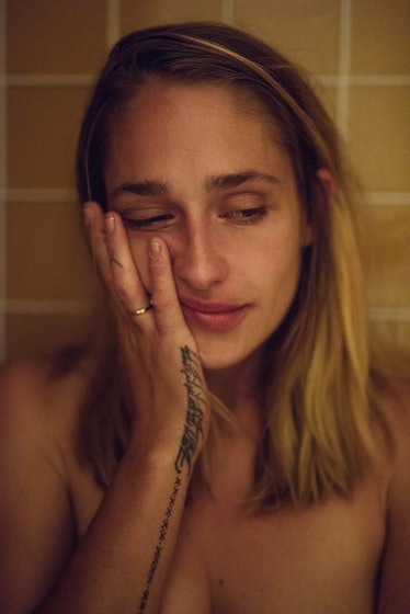A portrait of Jemima Kirke with her hand over her face by Katie McCurdy