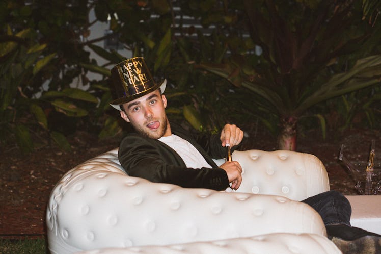 A man sticking his tongue out for a photo at the New Year’s Eve Bash at the Nobu Hotel Eden Roc, Mia...