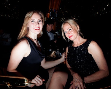 Two blonde women in black dresses smiling for a photo at the New Year’s Eve Blacktie Party at The To...