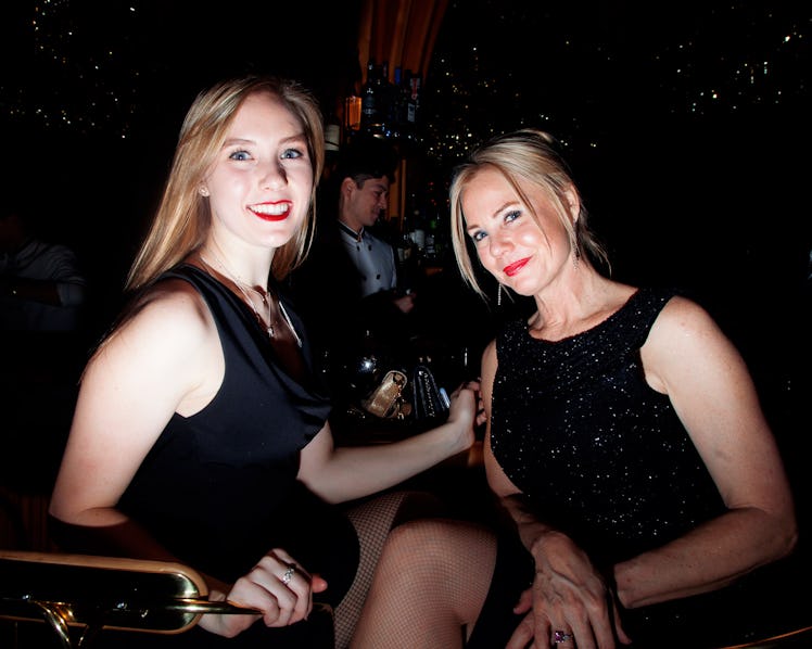 Two blonde women in black dresses smiling for a photo at the New Year’s Eve Blacktie Party at The To...