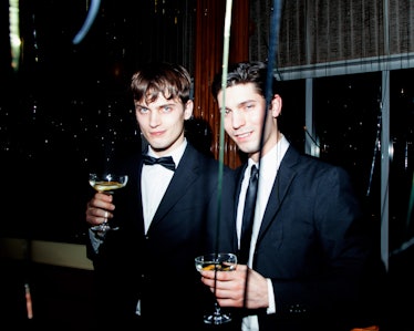 Two men in suits posing at New Year’s Eve Blacktie Party at The Top of The Standard