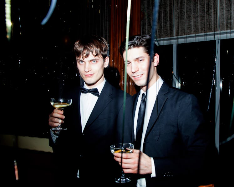 Two men in suits posing at New Year’s Eve Blacktie Party at The Top of The Standard