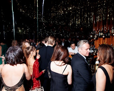 A group of people dancing in black-tie attire at the New Year’s Eve Blacktie Party at The Top of The...