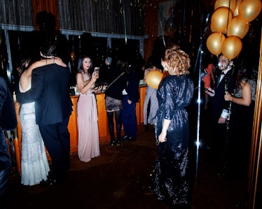 A group of men and women dancing at the New Year’s Eve Blacktie Party at The Top of The Standard