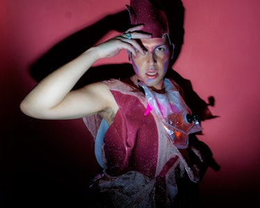 A man in a maroon bejeweled outfit with a matching headpiece at Ova the Rainbow : Dagger X OVA NYE a...