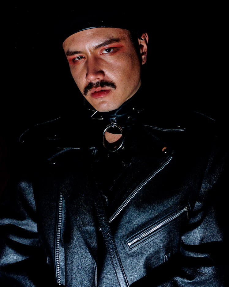 A man with red eyeshadow, a black choker and leather jacket at Ova the Rainbow : Dagger X OVA NYE at...