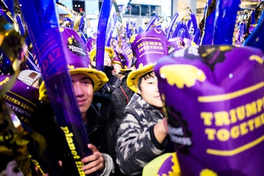 People gathered at Times Square wearing matching hats during the celebration of New Year's Eve 2017