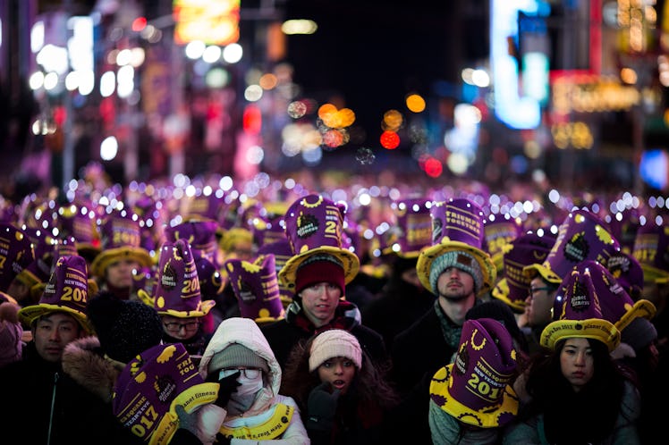 People gathered at Times Square wearing matching hats during the celebration of New Year's Eve 2017