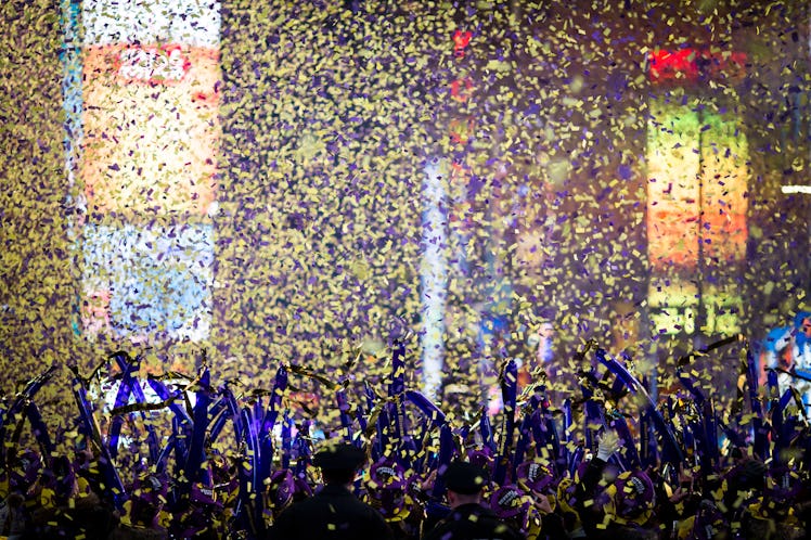 Confetti falling on a crowd gathered for New Year's Eve 2017 celebration at Times Square.