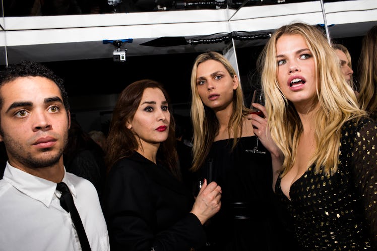 Andreja Pejic and Hailey Clauson with two of their friends all looking into the distance, shocked 