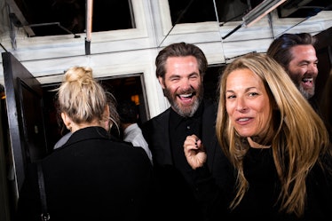 Chris Pine in a suit, laughing at W's Golden Globes Party 