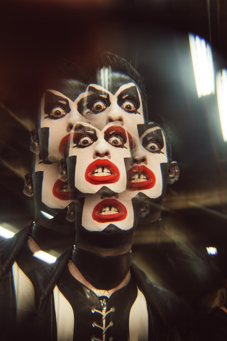 Multiplied face of a model with white face makeup at Charles Jeffrey’s MAN Fall 2017 presentation