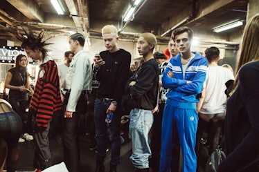 Five male models standing in a queue at Charles Jeffrey’s MAN Fall 2017 presentation at London Fashi...