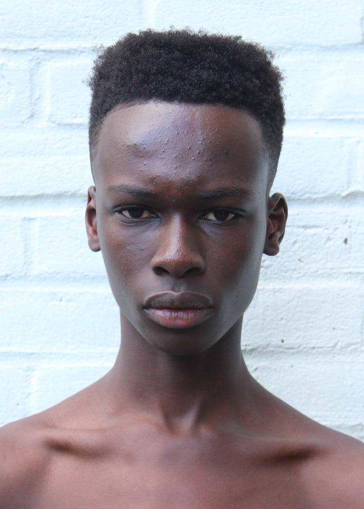 A male model Emmanuel Adjaye posing for a photo