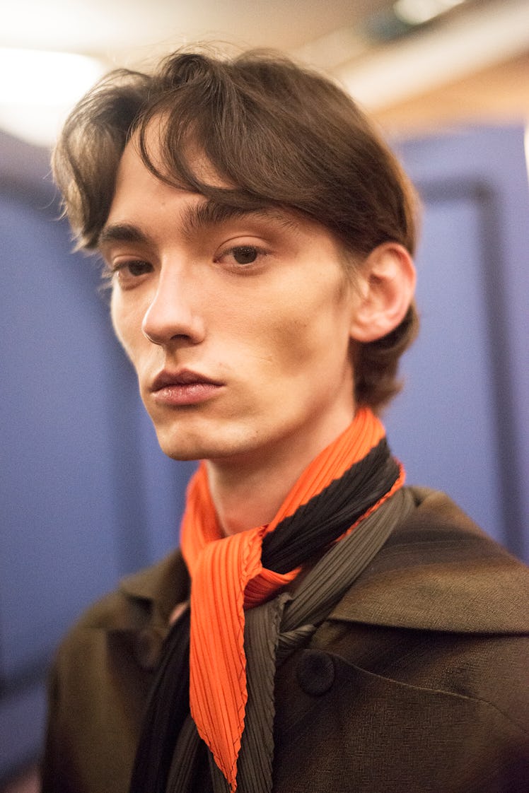 Model posing for a photo backstage at J.W. Anderson’s Fall/Winter 2017 fashion show.