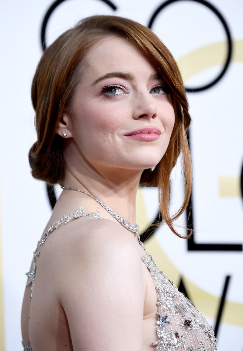 Actress Emma Stone at the Golden Globes 2017 in a silver sequin dress