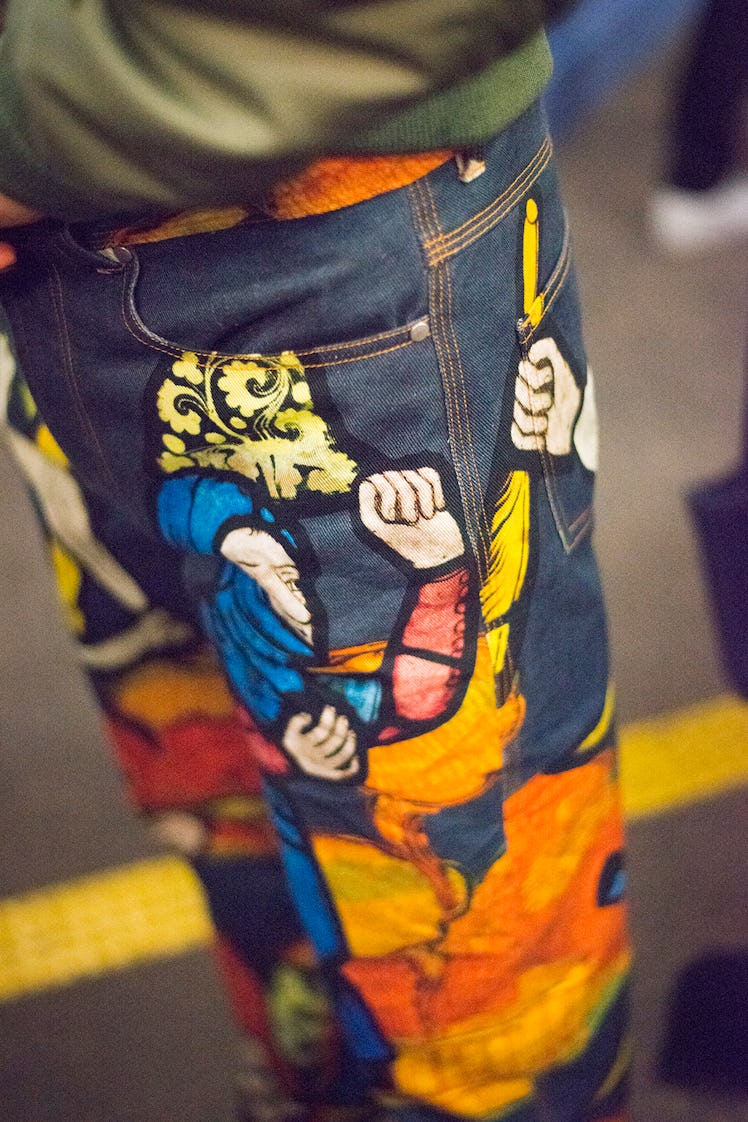 A model wearing illustrated jeans from J.W. Anderson’s Fall/Winter 2017 Collection.