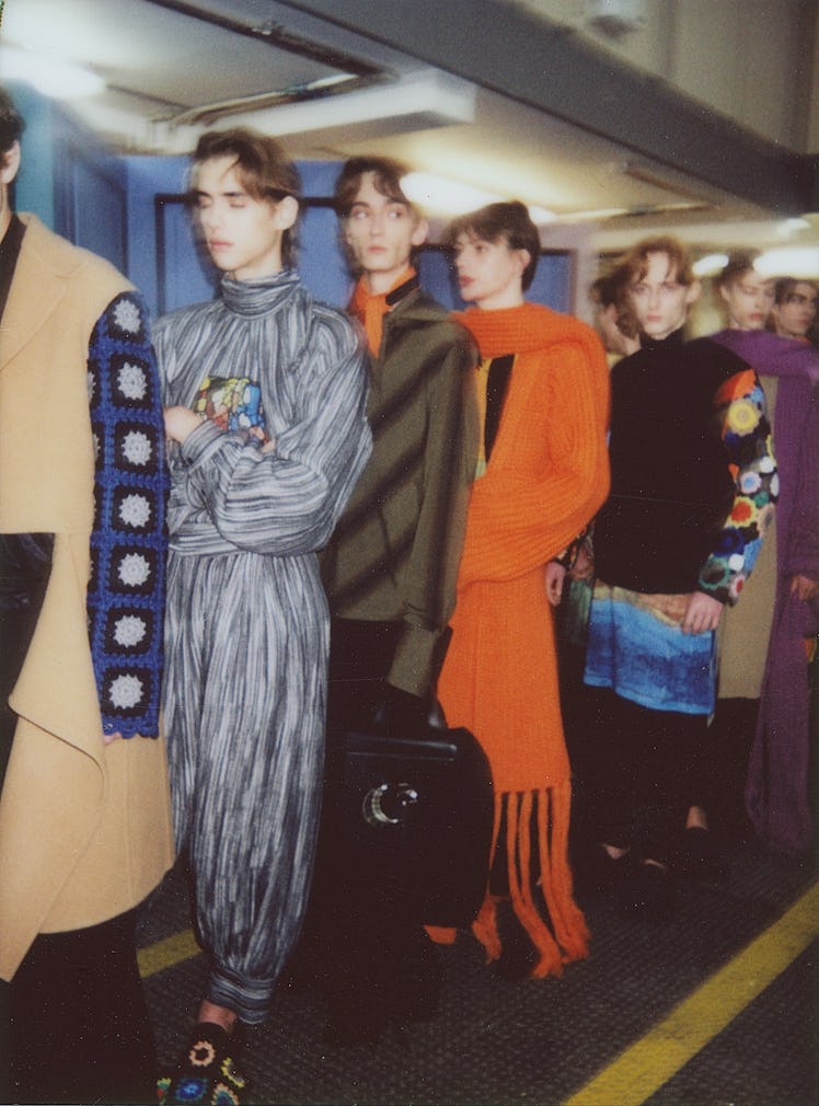 Models prepared for the runway backstage at J.W. Anderson’s Fall/Winter 2017 fashion show.