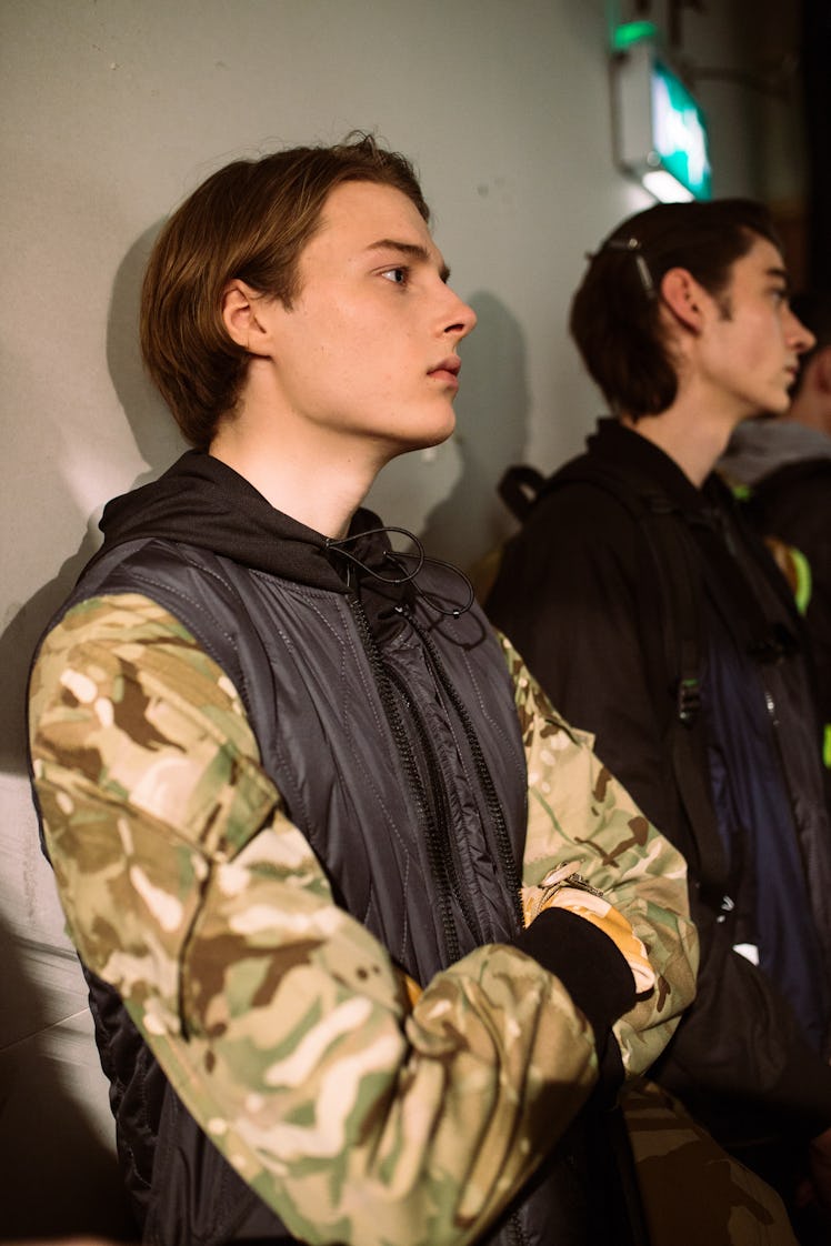 A model waiting backstage before London Men’s Designer Christopher Ræburn fashion show