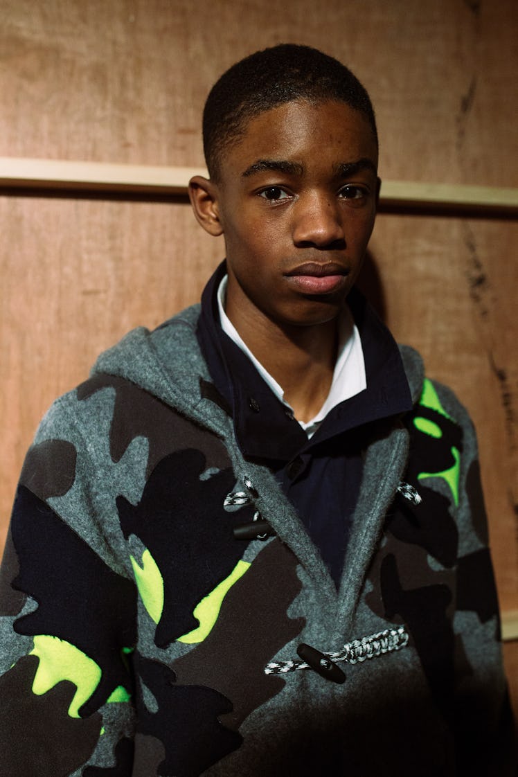 A model wearing a camouflage sweater from Christopher Ræburn’s Fall/Winter 2017 Collection.