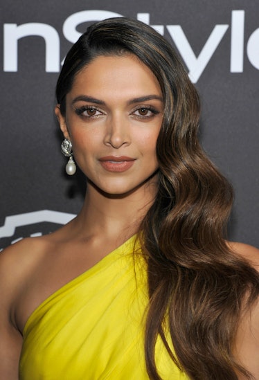 Deepika Padukone wearing a yellow dress and David Webb Jewels at InStyle Golden Globes Party.