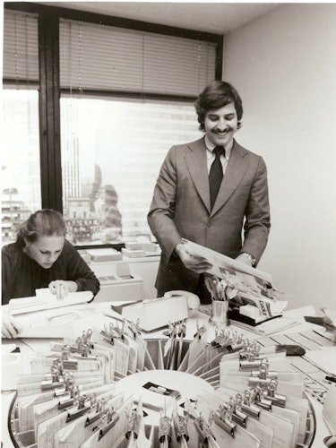 John Casablancas and his secretary go over various models files