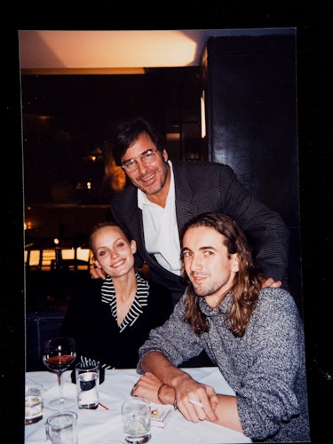 John Casablancas at a dinner with supermodels