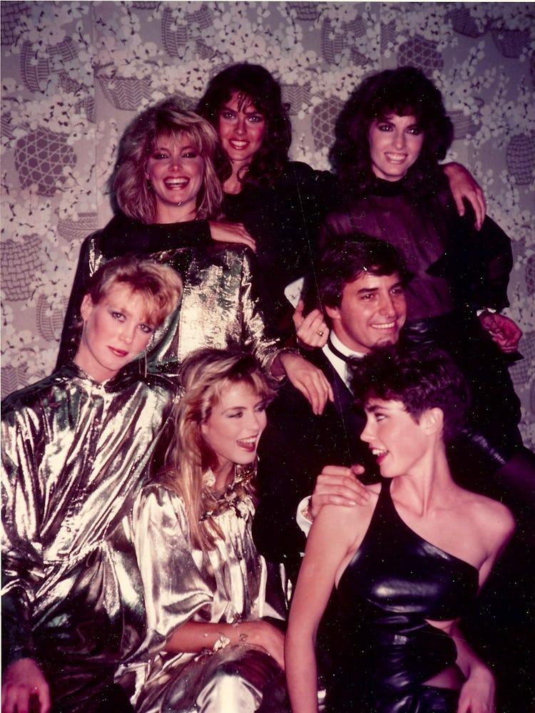 John Casablancas standing with many of his supermodels