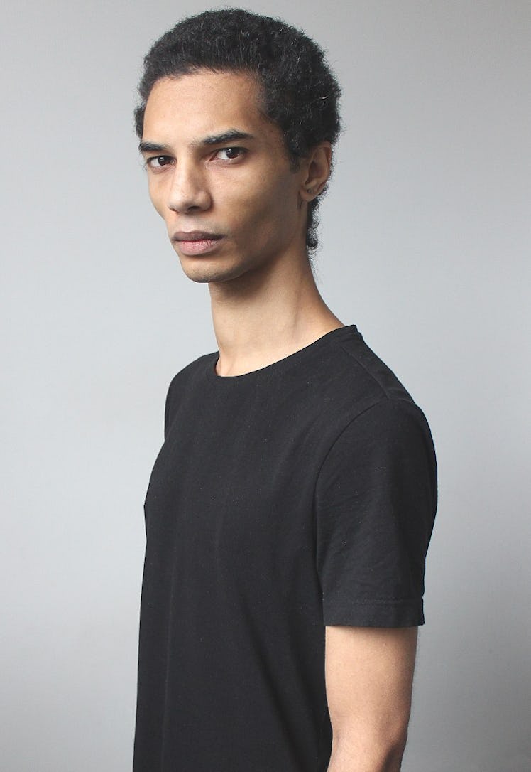 Male model, Filip Roseén posing in a black t-shirt.