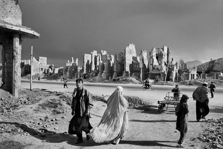 A group of people walking on a street at the Jade Maiwan Avenue, Kabul, Afghanistan