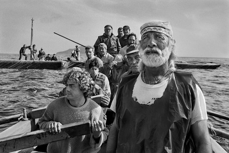 A group of men on a boat during the traditional tuna fishing ritual in La Mattanza, Trapani, Sicily,...