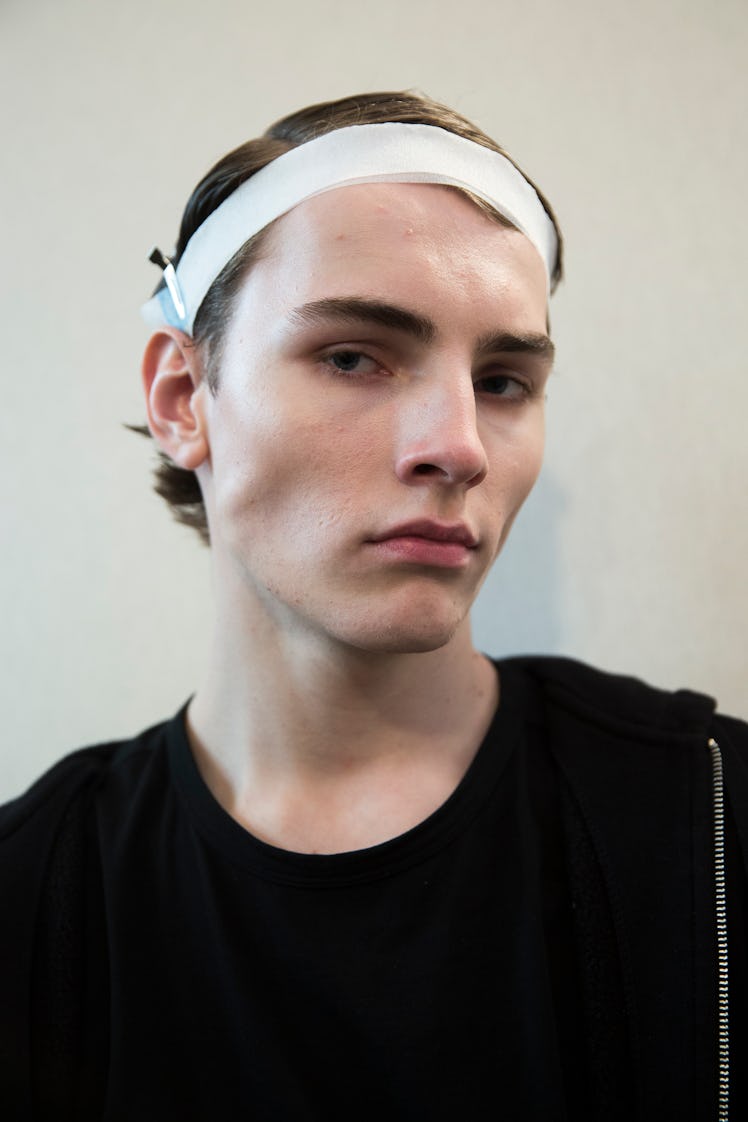 A model backstage at Balmain Men’s Fall 2017.