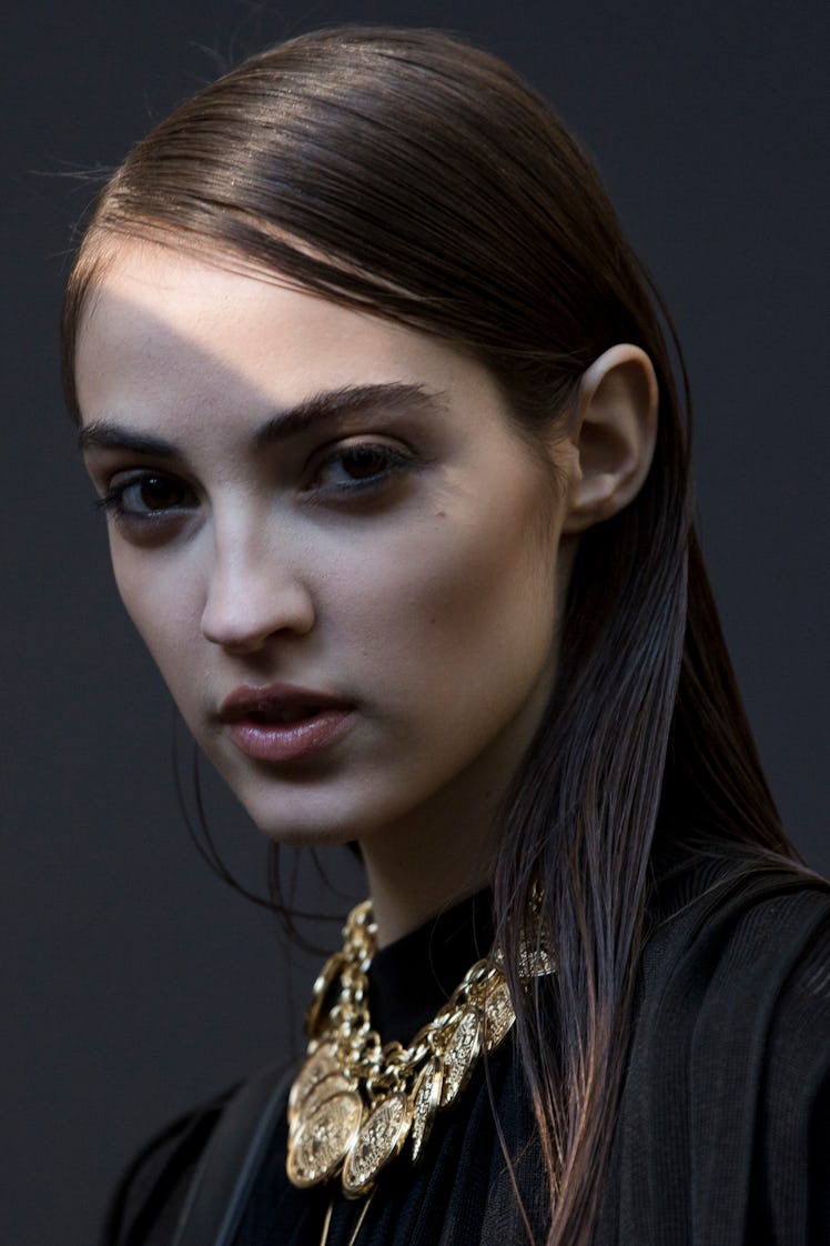 A model backstage at Balmain Men’s Fall 2017.