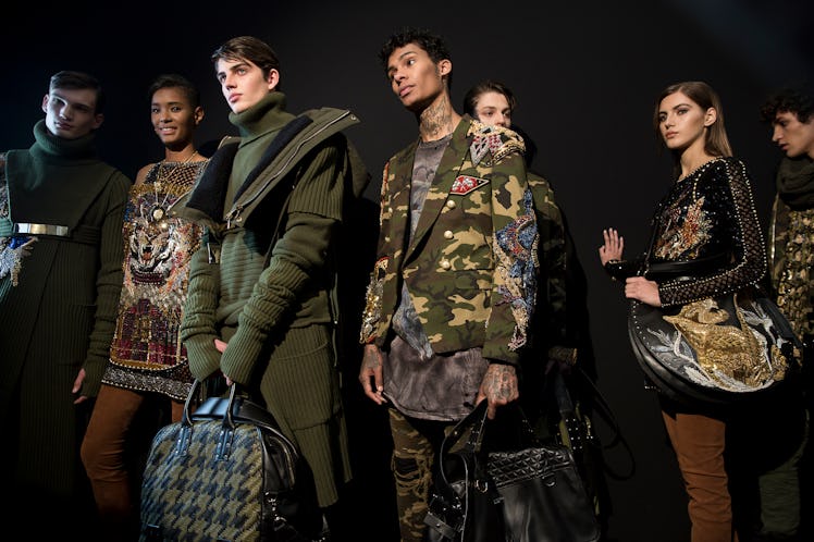 Models backstage at Balmain Men’s Fall 2017.