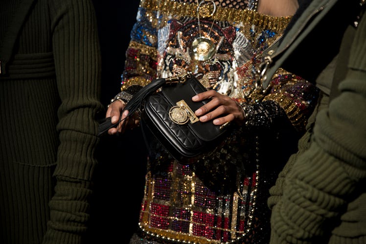 A model wearing rhinestone-adorned top from Balmain 2017 collection.