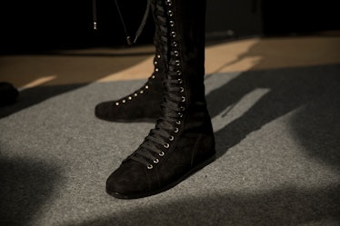 A model wearing Balmain Men’s Fall 2017 black lace-up boots