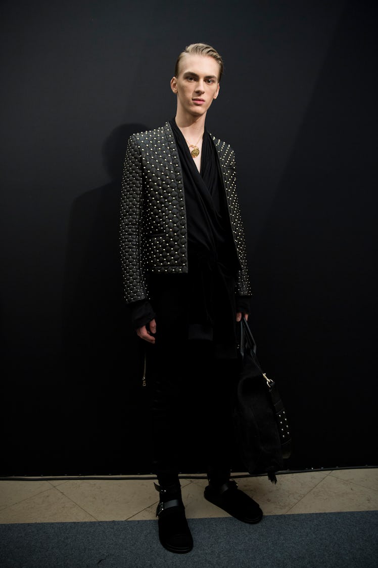 A model posing in a look from Balmain Men’s Fall 2017 collection.