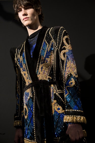 A model posing in a pearl-embellished Balmain Men’s Fall 2017 jacket.
