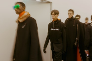 Models heading towards the runway at the Dior Homme Fall 2017 show