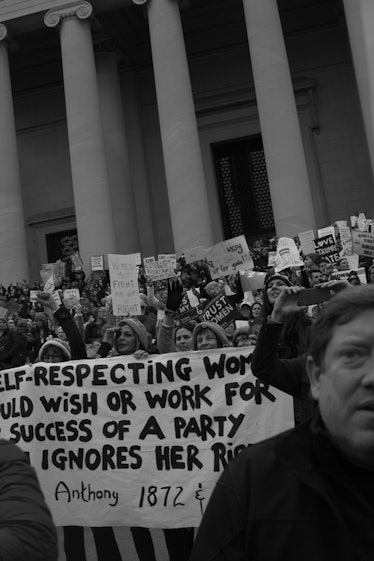 A group of people holding protest signs during the Women’s March in Washington D.C.